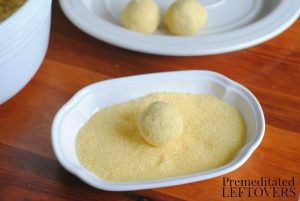 Easy-Lemon-Truffle-Recipe-Step-3-coating-truffle-in-lemon-sprinkles